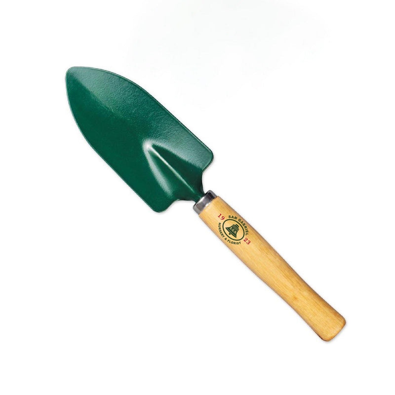 This shovel is part of the San Gabriel Nursery Anniversary pack for sale. The shovel has a green metal head, silver rim and a light wooden handle with the Mission bell printed on the material.